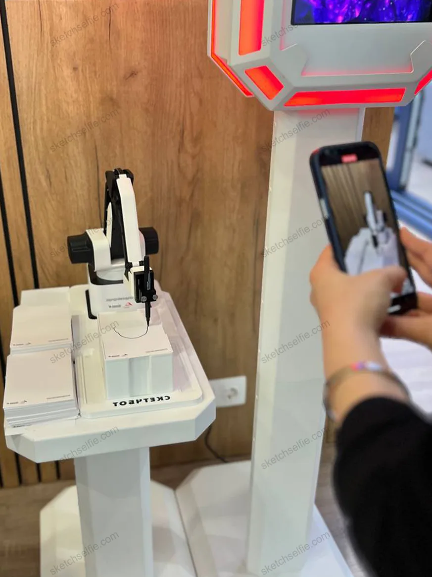 girl filming sketch robot drawing process