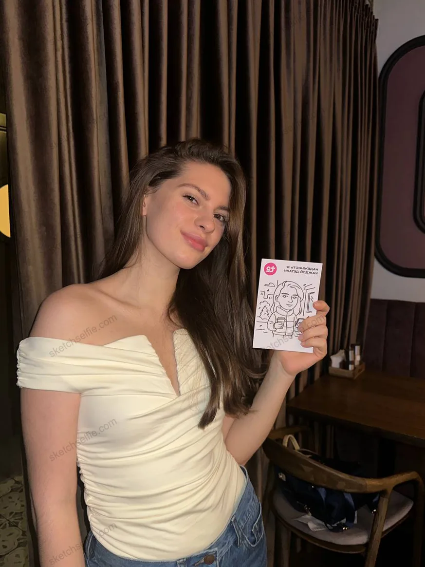 girl with a sketch robot portrait in hand