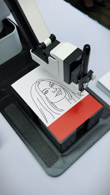 SketchSelfie robot drawing portraits live at event